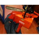 Dolmar PS-52 petrol chainsaw in metal carrybox along with Oregon chainsaw jacket