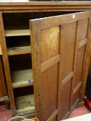Oak storage cupboard with single door and interior shelving