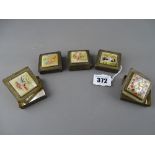 Five white metal lidded boxes with painted mother of pearl top panels
