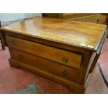 Neat two drawer coffee table with end flaps