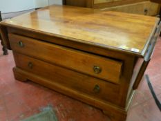 Neat two drawer coffee table with end flaps