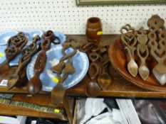Good quantity of lovespoons and other treen ware
