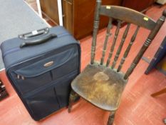 Vintage farmhouse chair and a modern canvas suitcase