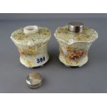 Pair of Doulton Burslem pottery canisters with silver lids and floral decoration