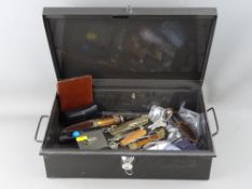 Metal strongbox with key containing a quantity of vintage pocket knives etc