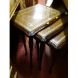 Set of three reproduction mahogany leather topped occasional tables with glass tops