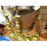 Helmet shaped coal scuttle and two pairs of brass candlesticks