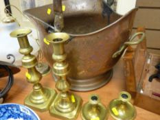 Helmet shaped coal scuttle and two pairs of brass candlesticks