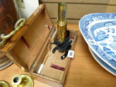 Small vintage microscope in a wooden box