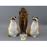 Three Russian porcelain animal figurines - two raccoons and an ape