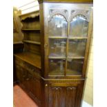 Priory style oak linenfold front dresser and near matching glass topped corner cabinet