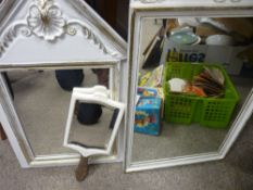 Two white and gilt painted wall mirrors and a hand held mirror