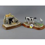 Two composite figurines of farmyard studies on wood effect bases