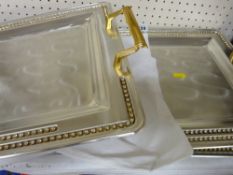 Three modern fancy white and yellow metal trays