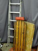 Small aluminium ladder along with a pasting table and a wooden undercar creeper