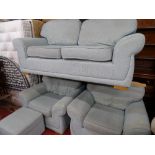 Modern light blue upholstered lounge suite of two seater settee, two armchairs and matching