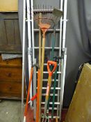 Multi-purpose ladder and a parcel of long handled garden tools