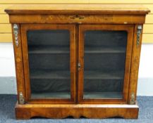 NINETEENTH CENTURY WALNUT TWO-DOOR CHIFFONIER / PIER CABINET the projecting top above floral &
