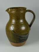 DAVID LLOYD JONES STUDIO POTTERY JUG with loop handle and mottled glaze, potter's mark, 22cms high