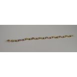 A 9CT YELLOW GOLD MULTI-COLOUR STONE SET BRACELET including sapphires