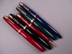 FOUR VINTAGE PARKER DUOFOLD FOUNTAIN PENS in black, blue, green & red, all with 13k nibs together
