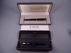 A VINTAGE BOXED BLUE PARKER SLIMFOLD FOUNTAIN PEN with 14k nib & gold plated trim together with a