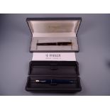 A VINTAGE BOXED BLUE PARKER SLIMFOLD FOUNTAIN PEN with 14k nib & gold plated trim together with a