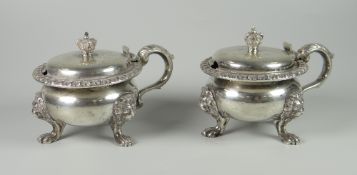 A PAIR OF HEAVY SILVER LIDDED BALUSTER POTS OR SALTS with scroll handle, raised on three lion mask &