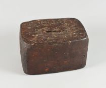 AN EARTHENWARE BRICK MONEY BOX of primitive form and inscribed John Ellis 1827, 7cms high x 12cms