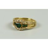 AN 18K GOLD EMERALD & DIAMOND CHIP BUCKLE RING, 5.2grams approx, (size P/Q)