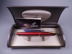 A MODERN (2001-2004) SUNNY RED PARKER INFLECTION FOUNTAIN PEN with gold plated trim & stainless