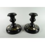 PAIR OF INLAID BLACK MARBLE CIRCULAR CANDLESTICKS inlaid with flowers & foliage, 11.5cms high (2)