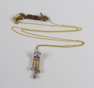 A 9CT YELLOW GOLD FINE NECKLACE ON TANZANITE PENDANT