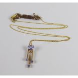 A 9CT YELLOW GOLD FINE NECKLACE ON TANZANITE PENDANT