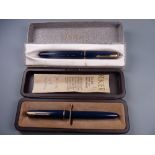 TWO VINTAGE BOXED BLUE PARKER DUOFOLD JUNIOR FOUNTAIN PENS both with gold plated trim & 14ct gold