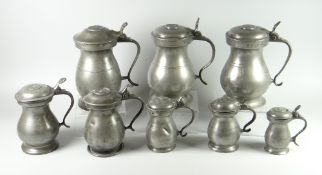COLLECTION OF EIGHT VICTORIAN PEWTER POT-BELLIED LIDDED FLAGONS OF VARIOUS SIZE to include pint,