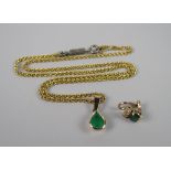 A 14K YELLOW GOLD TWIST NECKLACE with emerald pendant & matching earrings, 12grams approx.