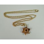 A 9CT ROSE GOLD CLOGAU DAFFODIL PENDANT & FINE NECKLACE