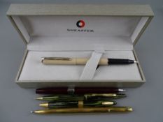 COLLECTION OF FIVE SHEAFFER PENS including Triumph Crest & Tuckaway propelling pencils, Triumph