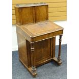 VICTORIAN WALNUT INLAID DAVENPORT DESK having raised top with brass gallery above two blind panelled