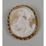 A FINE YELLOW METAL ANTIQUE CAMEO BROOCH PORTRAIT of maiden feeding bird (in associated box)