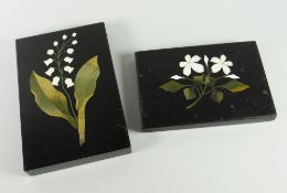 NINETEENTH CENTURY BLACK MARBLE RECTANGULAR PAPERWEIGHT having inlaid floral design, 9.5 x 14.5cms