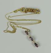 A 9CT YELLOW GOLD & TANZANITE PENDANT & NECKALCE with magnetic barrel-clasp