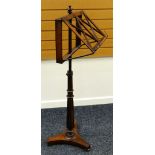 LATE NINETEENTH CENTURY ROSEWOOD MUSIC STAND having turned finial above ratchet design adjustable
