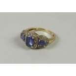 A 14K / 585 YELLOW GOLD POSSIBLY ALEXANDRITE THREE-STONE RING, 4.5grams approx, (size O)