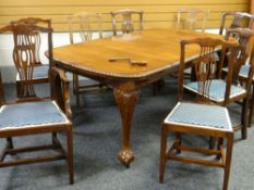 A GEORGIAN-STYLE MAHOGANY EXTENDING DINING TABLE on raised cabriole legs with ball & claw feet &