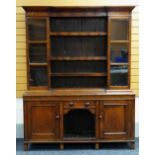 NINETEENTH CENTURY OAK TWO-STAGE DRESSER the cabinet back having three central open shelves, flanked