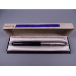 A VINTAGE BLACK PARKER 51 FOUNTAIN PEN with Lustraloy cap & chrome plated clip, in original box (