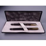 A MODERN MATT BLACK PARKER RIALTO FOUNTAIN PEN& BALLPOINT PEN SET with gold plated trim & nib, in