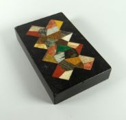 NINETEENTH CENTURY BLACK MARBLE RECTANGULAR PAPERWEIGHT inlaid with geometric patchwork or scrapwork